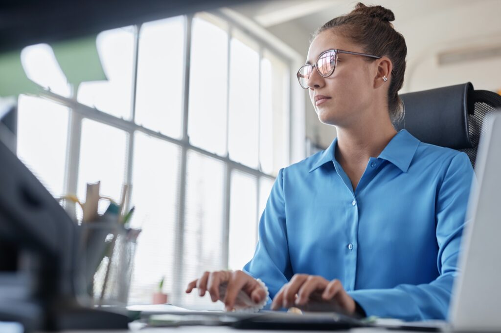 Businesswoman working on computer in office